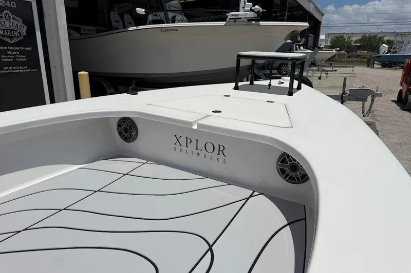 Slide: The Image of 2024 Delta Boatworks Delta D18 with sleek deck design at a marina. - 7