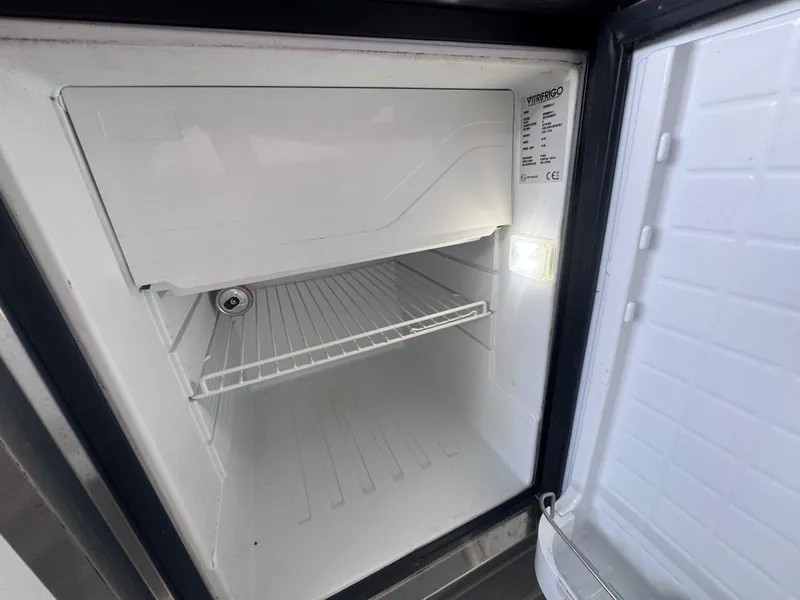 Slide: The Image of Empty fridge in 2023 Cruisers Yachts 38 GLS. - 11