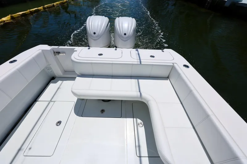 Slide: The Image of 2025 Contender 32 ST boat with dual engines and spacious seating area. - 12