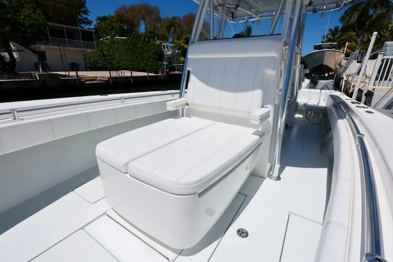 Slide: The Image of 2025 Contender 32 ST boat interior with white seating and sleek design. - 15
