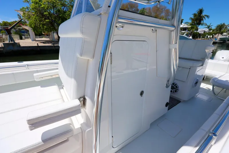 Slide: The Image of 2025 Contender 32 ST boat interior with sleek white seating and modern design. - 20