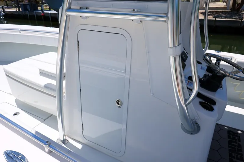 Slide: The Image of 2025 Contender 32 ST boat console with sleek design and stainless steel accents. - 22