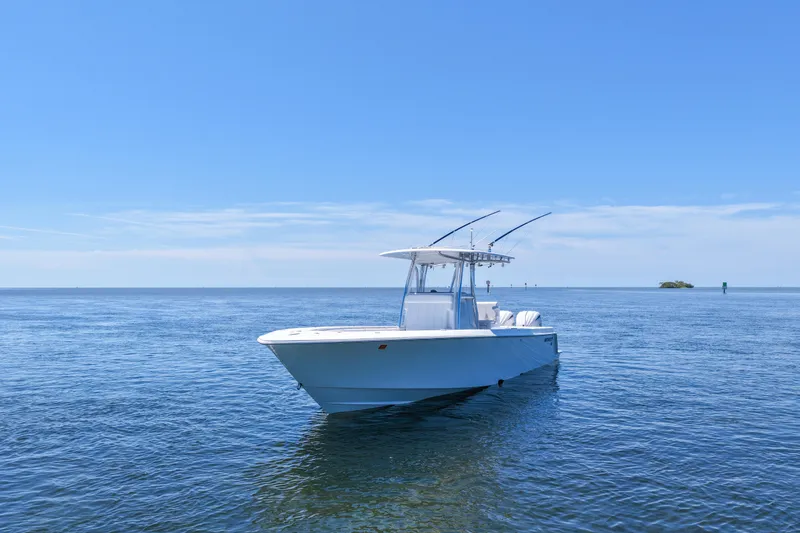 Slide: The Image of 2025 Contender 32 ST boat on calm ocean under clear blue sky. - 7