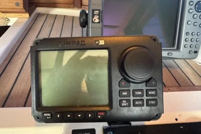 Slide: The Image of Simrad AP28 autopilot control on 1983 Nordic Tug 26 boat dashboard. - 15