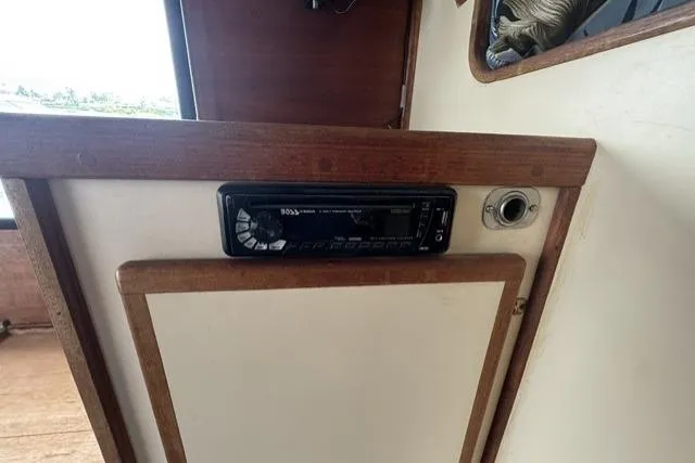 Slide: The Image of 1983 Nordic Tug 26 interior with a modern stereo system installed. - 20