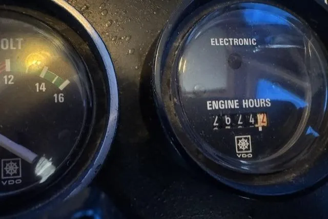 Slide: The Image of Close-up of Nordic Tug 26 gauges showing voltage and engine hours, 1983 model. - 23