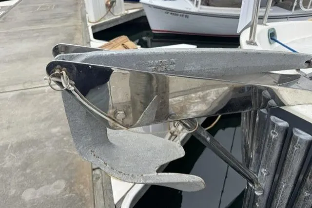 Slide: The Image of Anchor on 1983 Nordic Tug 26 boat docked at marina. - 25