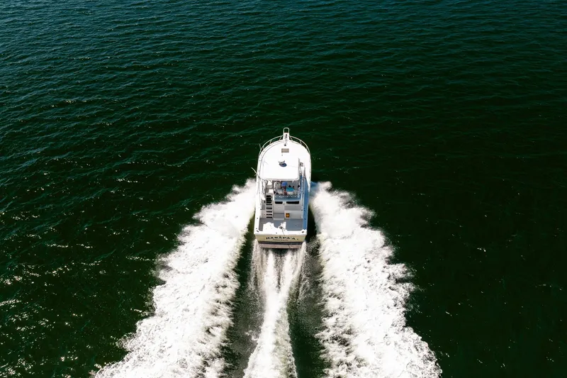 Slide: The Image of Aerial view of 1994 Luhrs 38 Convertible boat cruising on open water. - 30