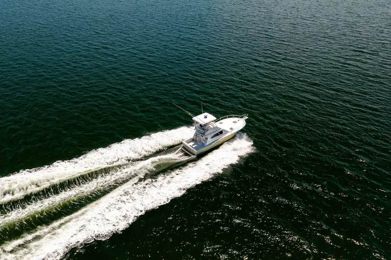 Slide: The Image of Aerial view of 1994 Luhrs 38 Convertible yacht cruising on open water. - 36
