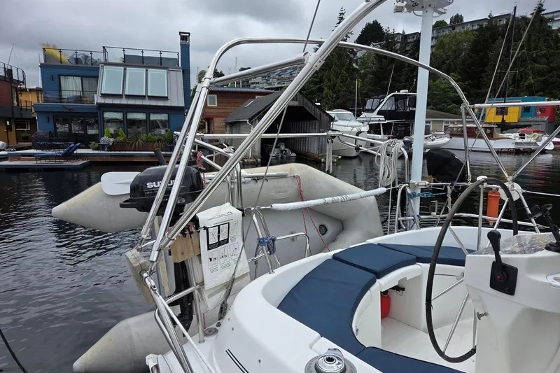 Slide: The Image of Beneteau Oceanis 411 sailboat docked at Signature showing davits and dinghy - 15