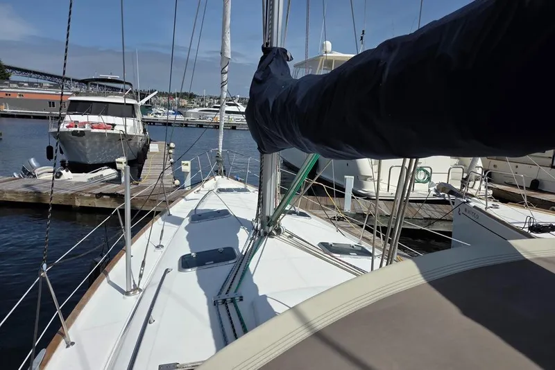 Slide: The Image of Beneteau Oceanis 411 sailboat docked at Signature, showcasing deck and rigging - 17