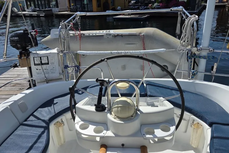 Slide: The Image of Cockpit of a 2000 Beneteau Oceanis 411 sailboat showing davits and dinghy - 19