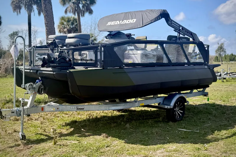 The Image of 2026 Sea-Doo Switch Fish 21 on trailer, parked outdoors under sunny skies. - 0