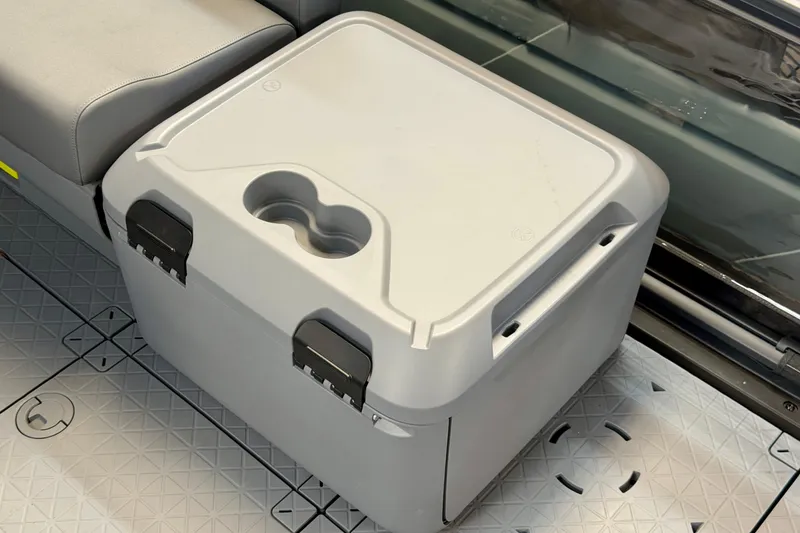 Slide: The Image of Cooler on 2026 Sea-Doo Switch Fish 21 boat, featuring cup holder and secure latches. - 16