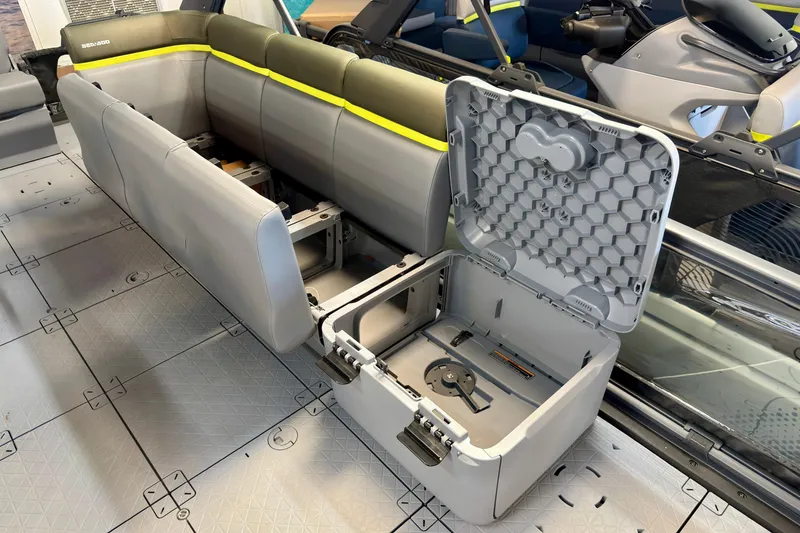 Slide: The Image of 2026 Sea-Doo Switch Fish 21 interior with open storage compartments and seating. - 23