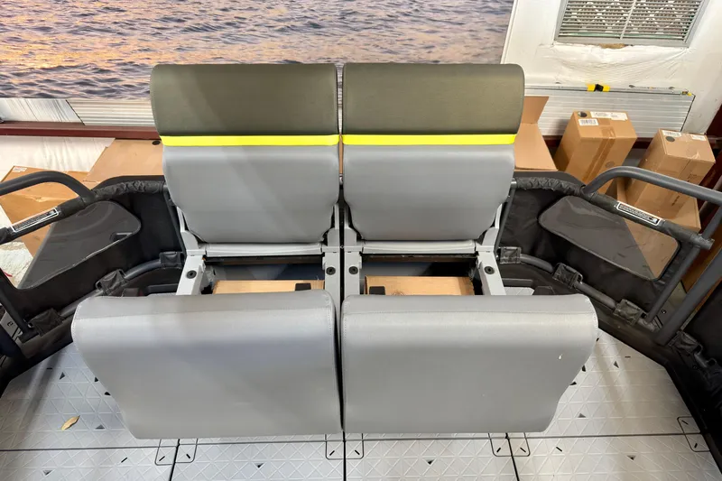 Slide: The Image of 2026 Sea-Doo Switch Fish 21 interior seating with adjustable backrests and storage compartments. - 24