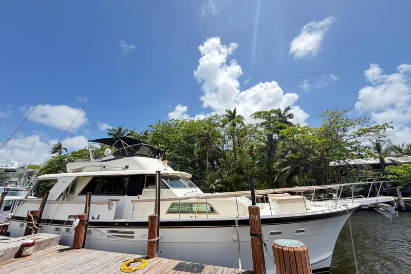 The Image of 1978 Hatteras 53 Motor Yacht docked under a clear blue sky. - 0