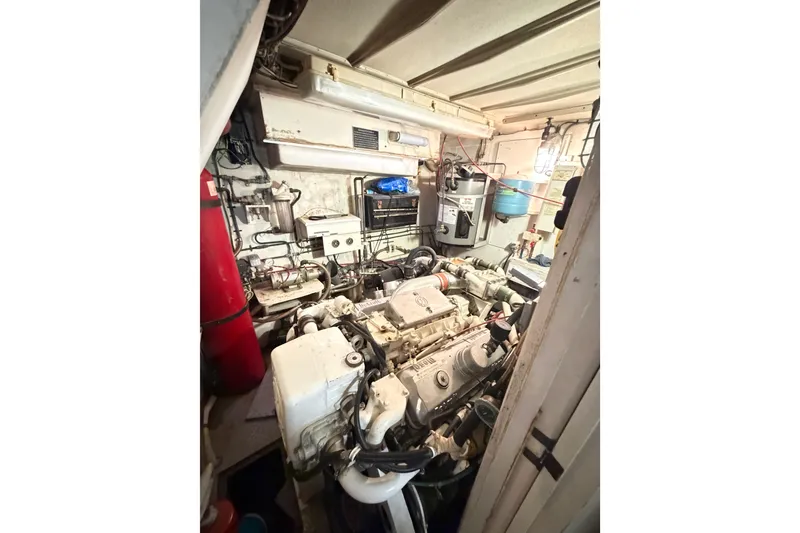 Slide: The Image of Engine room of a 1978 Hatteras 53 Motor Yacht, showcasing mechanical components. - 15