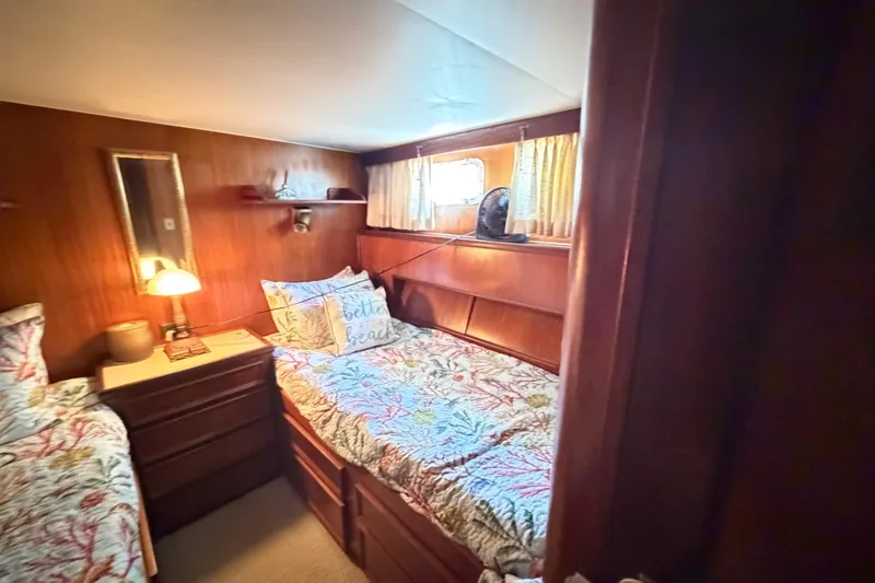 Slide: The Image of Cozy bedroom in 1978 Hatteras 53 Motor Yacht with twin beds and nautical decor. - 17