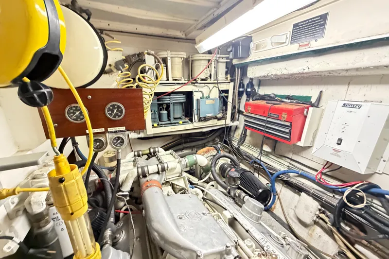 Slide: The Image of Engine room of a 1978 Hatteras 53 Motor Yacht with gauges and tools. - 27