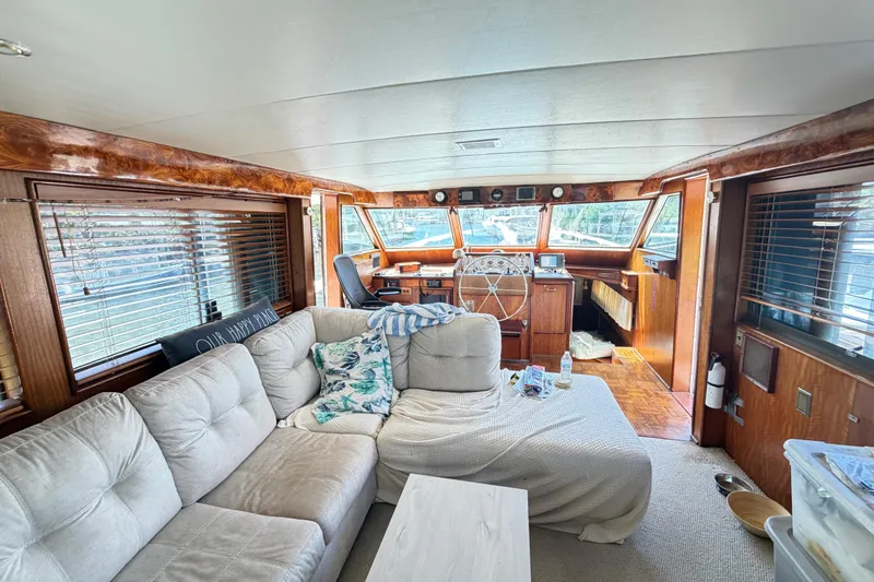 Slide: The Image of Interior of a 1978 Hatteras 53 Motor Yacht with cozy seating and helm. - 28