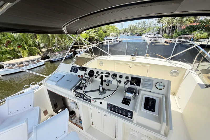 Slide: The Image of 1978 Hatteras 53 Motor Yacht helm with steering wheel and navigation equipment. - 35