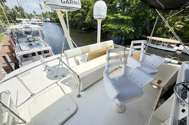 Slide: The Image of 1978 Hatteras 53 Motor Yacht deck with seating and navigation equipment. - 38
