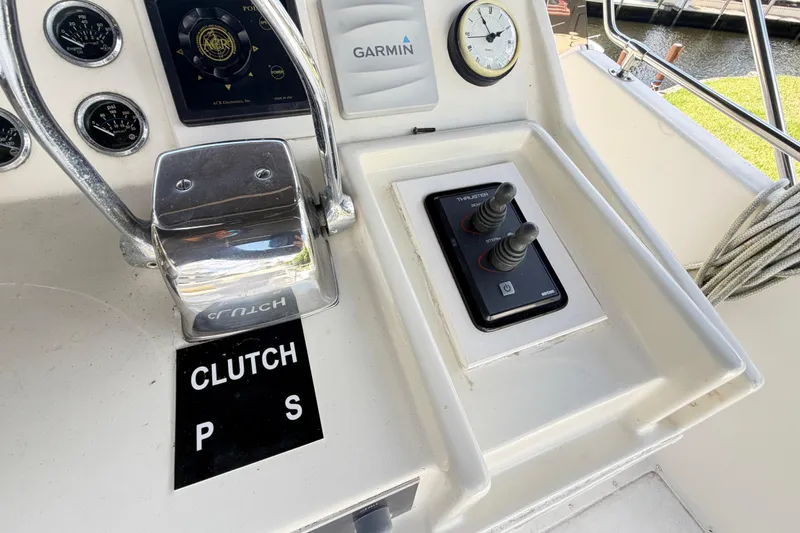 Slide: The Image of Control panel of a 1978 Hatteras 53 Motor Yacht with clutch and thruster controls. - 43