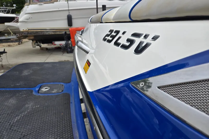 Slide: The Image of 2004 Malibu Wakesetter 23 LSV boat detail with logo, docked in marina. - 14