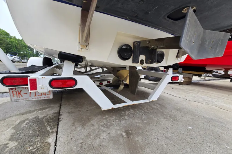 Slide: The Image of 2004 Malibu Wakesetter 23 LSV boat on trailer, rear view showing propeller and license plate. - 17