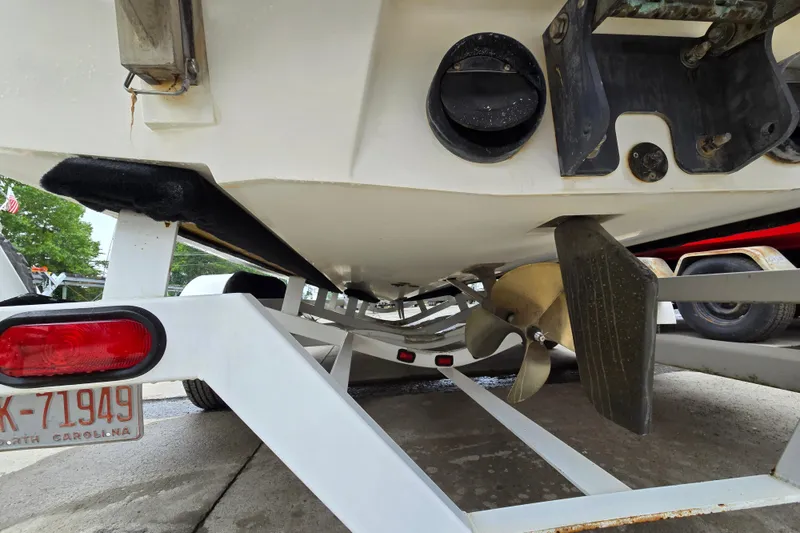 Slide: The Image of 2004 Malibu Wakesetter 23 LSV boat on trailer, showing propeller and rudder details. - 18