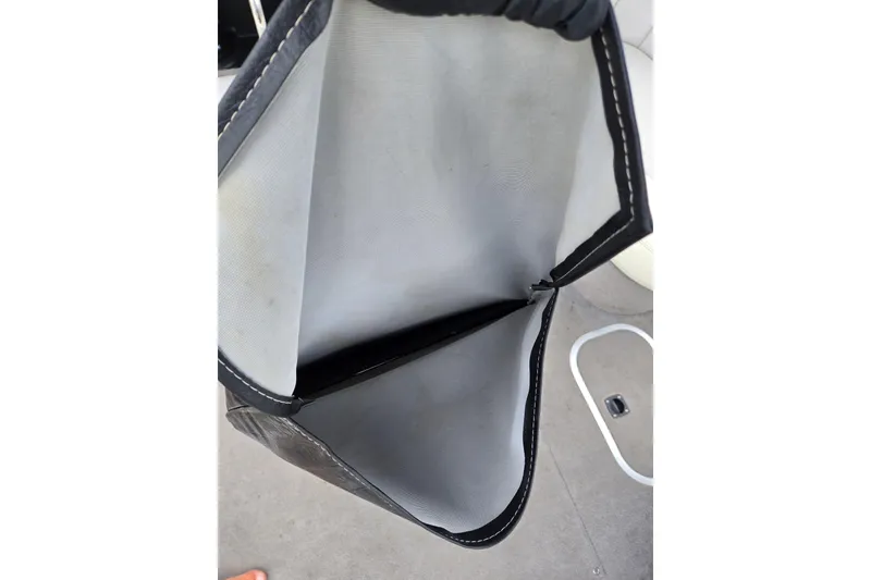 Slide: The Image of Open storage compartment on a 2004 Malibu Wakesetter 23 LSV boat. - 29