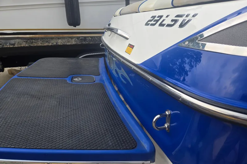 Slide: The Image of 2004 Malibu Wakesetter 23 LSV boat, blue and white exterior, rear view. - 4