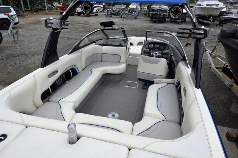 Slide: The Image of 2004 Malibu Wakesetter 23 LSV interior with spacious seating and modern dashboard. - 42