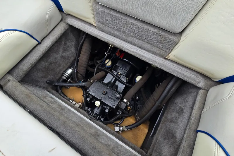 Slide: The Image of Engine compartment of a 2004 Malibu Wakesetter 23 LSV boat, showcasing mechanical components. - 47