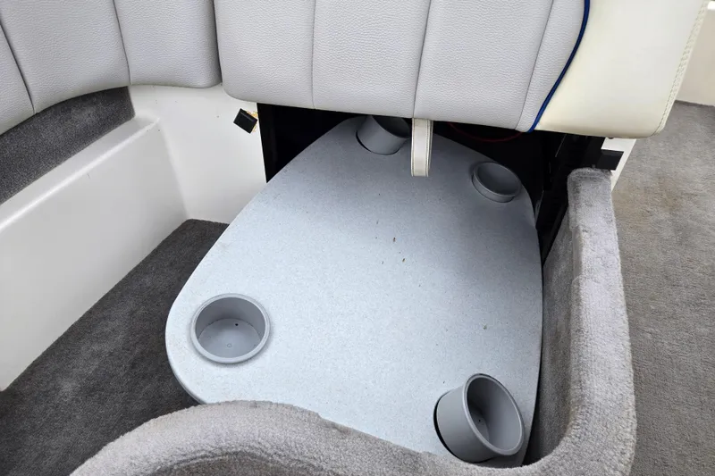 Slide: The Image of 2004 Malibu Wakesetter 23 LSV interior with cup holders and seating area. - 49