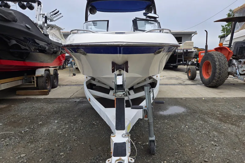 Slide: The Image of 2004 Malibu Wakesetter 23 LSV boat on trailer in a marina. - 5