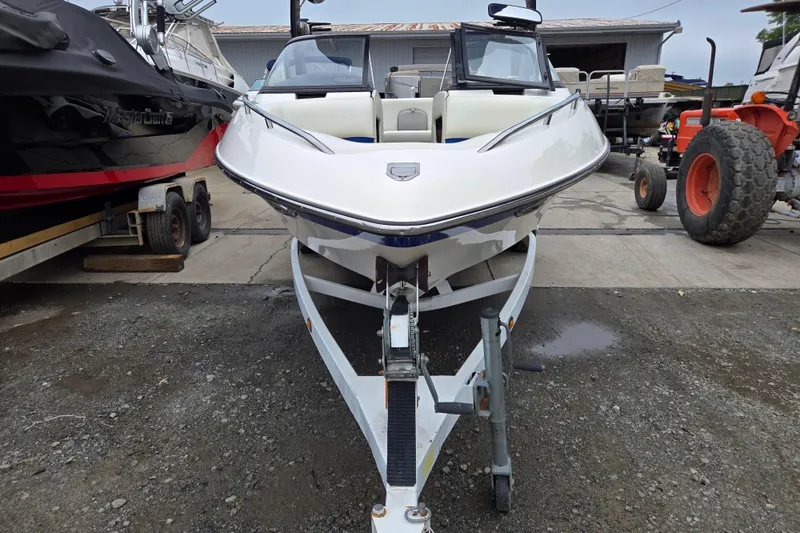 Slide: The Image of 2004 Malibu Wakesetter 23 LSV boat on trailer in a storage yard. - 6