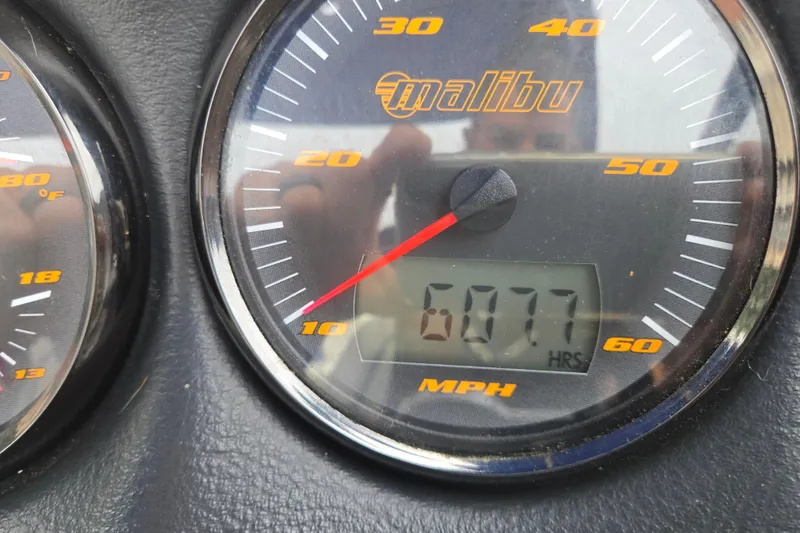 Slide: The Image of Close-up of 2004 Malibu Wakesetter 23 LSV speedometer showing 6077 hours. - 67