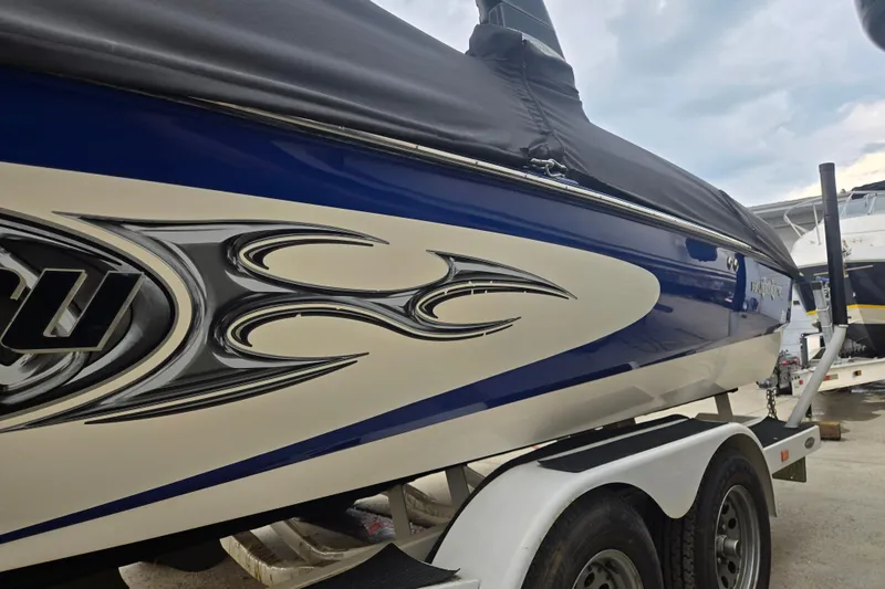 Slide: The Image of 2004 Malibu Wakesetter 23 LSV boat with custom graphics on trailer. - 7