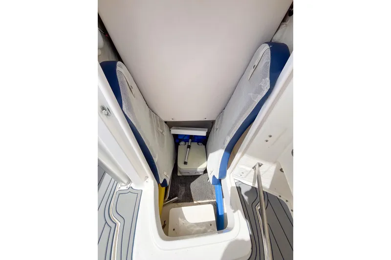 Slide: The Image of 2017 Robalo R222 Center Console interior seating and storage area. - 10
