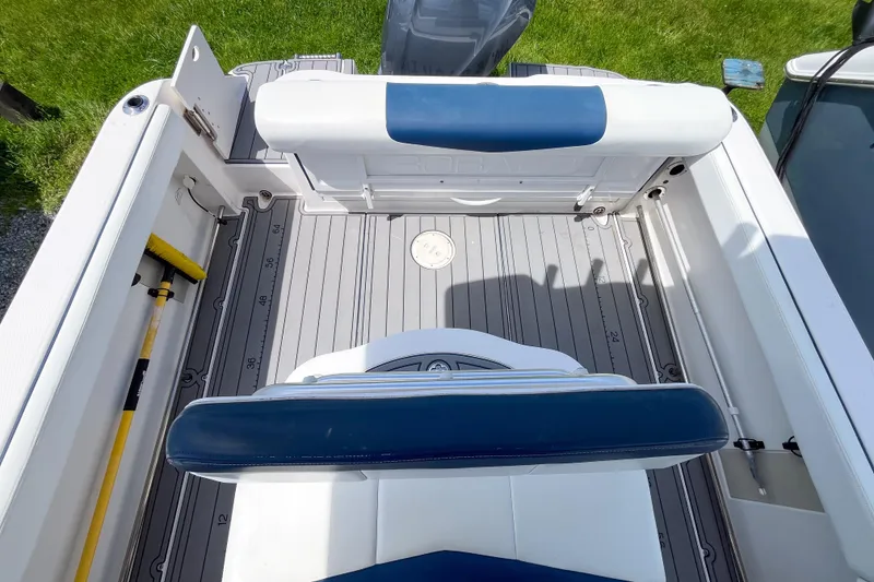 Slide: The Image of 2017 Robalo R222 Center Console boat interior with seating and deck view. - 2