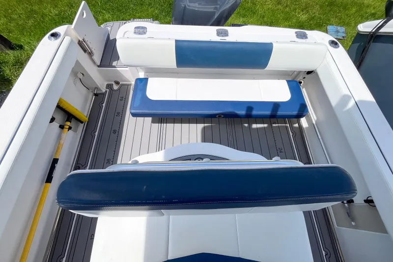 Slide: The Image of 2017 Robalo R222 Center Console boat interior with blue and white seating. - 3