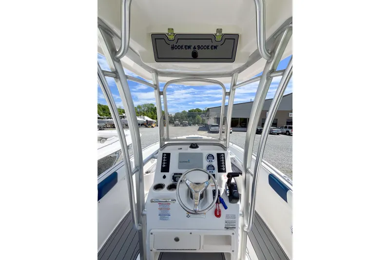 Slide: The Image of 2017 Robalo R222 Center Console boat interior with steering wheel and controls. - 6