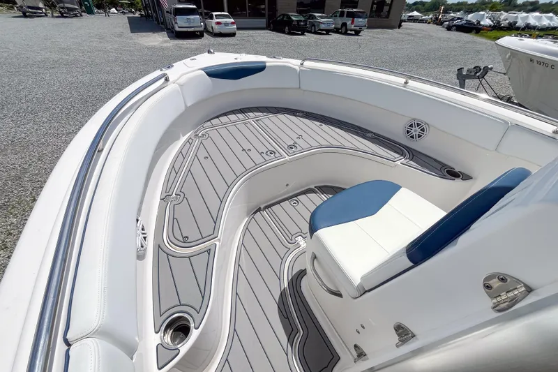 Slide: The Image of 2017 Robalo R222 Center Console boat interior with cushioned seating and sleek deck design. - 7
