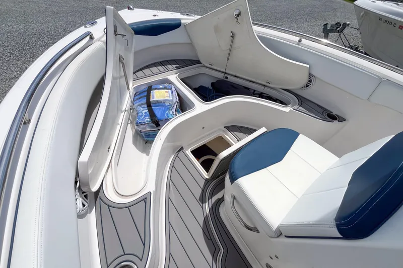 Slide: The Image of 2017 Robalo R222 Center Console boat interior with seating and storage compartments. - 8