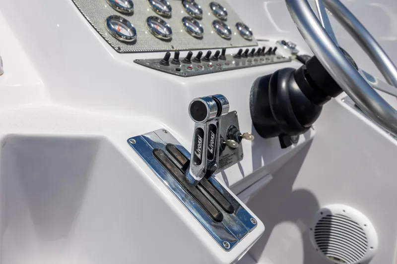 Slide: The Image of Close-up of 2014 Baja 35 Outlaw boat controls and steering wheel. - 17