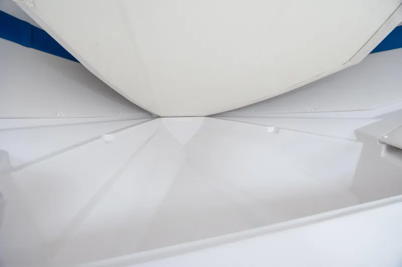 Slide: The Image of 2014 Baja 35 Outlaw boat interior, showcasing sleek white design and modern craftsmanship. - 23