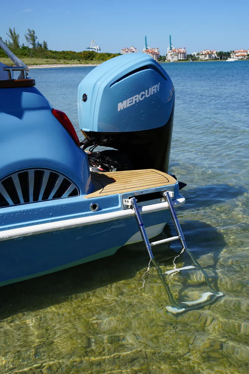 Slide: The Image of Fiat 500 Classic boat with Mercury engine in shallow water, 2025 model. - 18