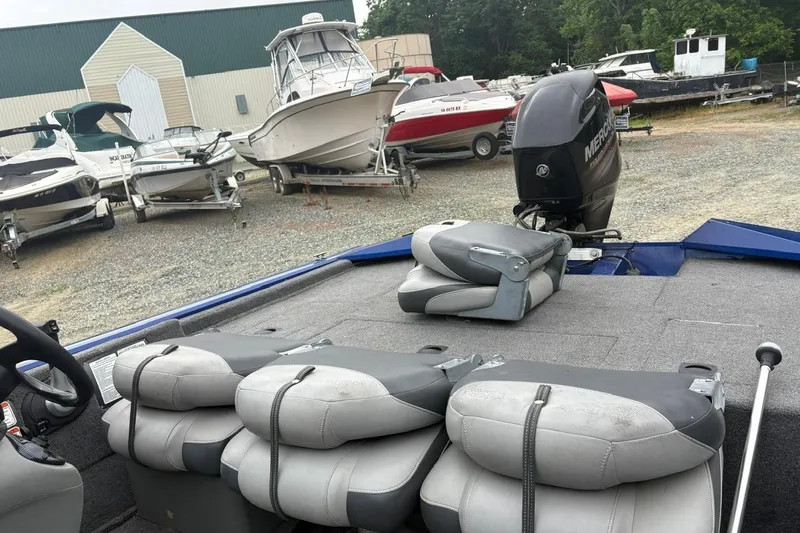 Slide: The Image of 2015 Tracker Pro Team 175 TF boat with Mercury engine in a boatyard. - 11